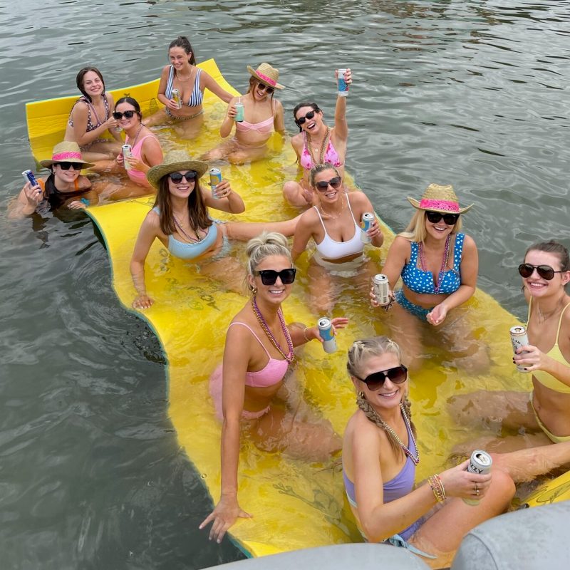 a group of people on a raft in a body of water