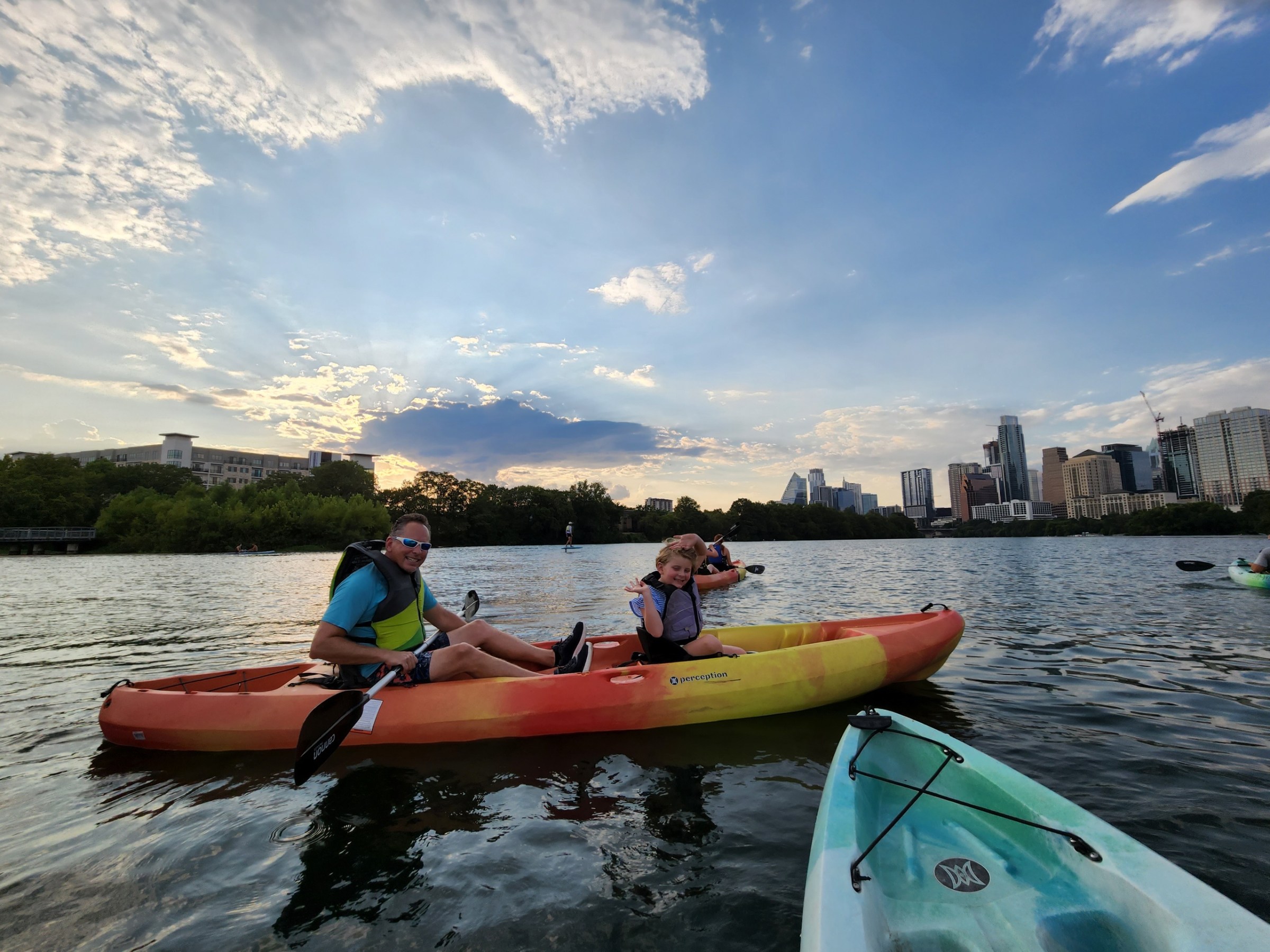 a group of people in a small boat in a body of water